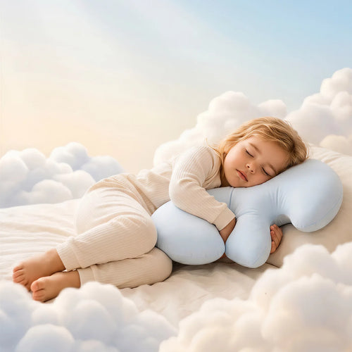 A child asleep on the Booney pillow in a world of soft golden clouds