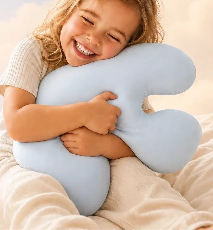 A child hugging the Booney pillow